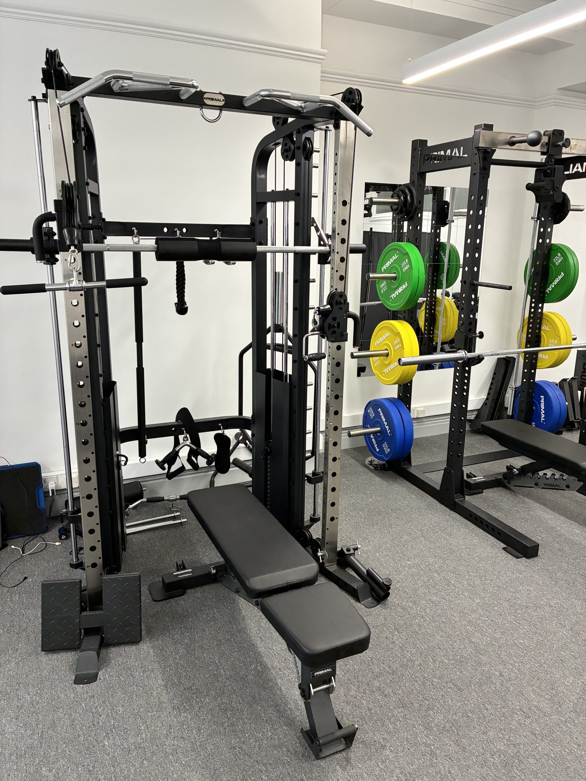 Facilities 1 Shows a smith machine and squat rack used as part of physiotherapy rehabilitation and personal training
