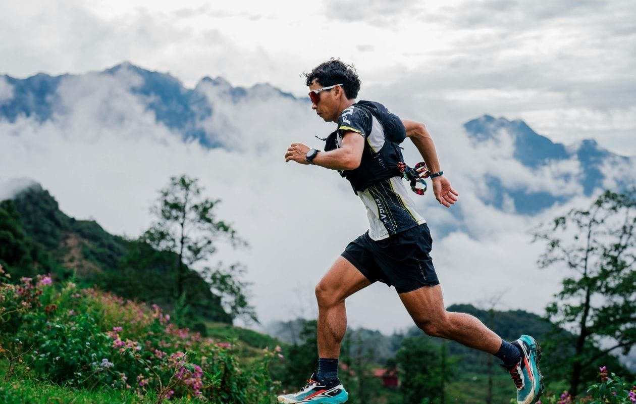 Trail runner training in mountains, supported by running injury rehabilitation in Manchester