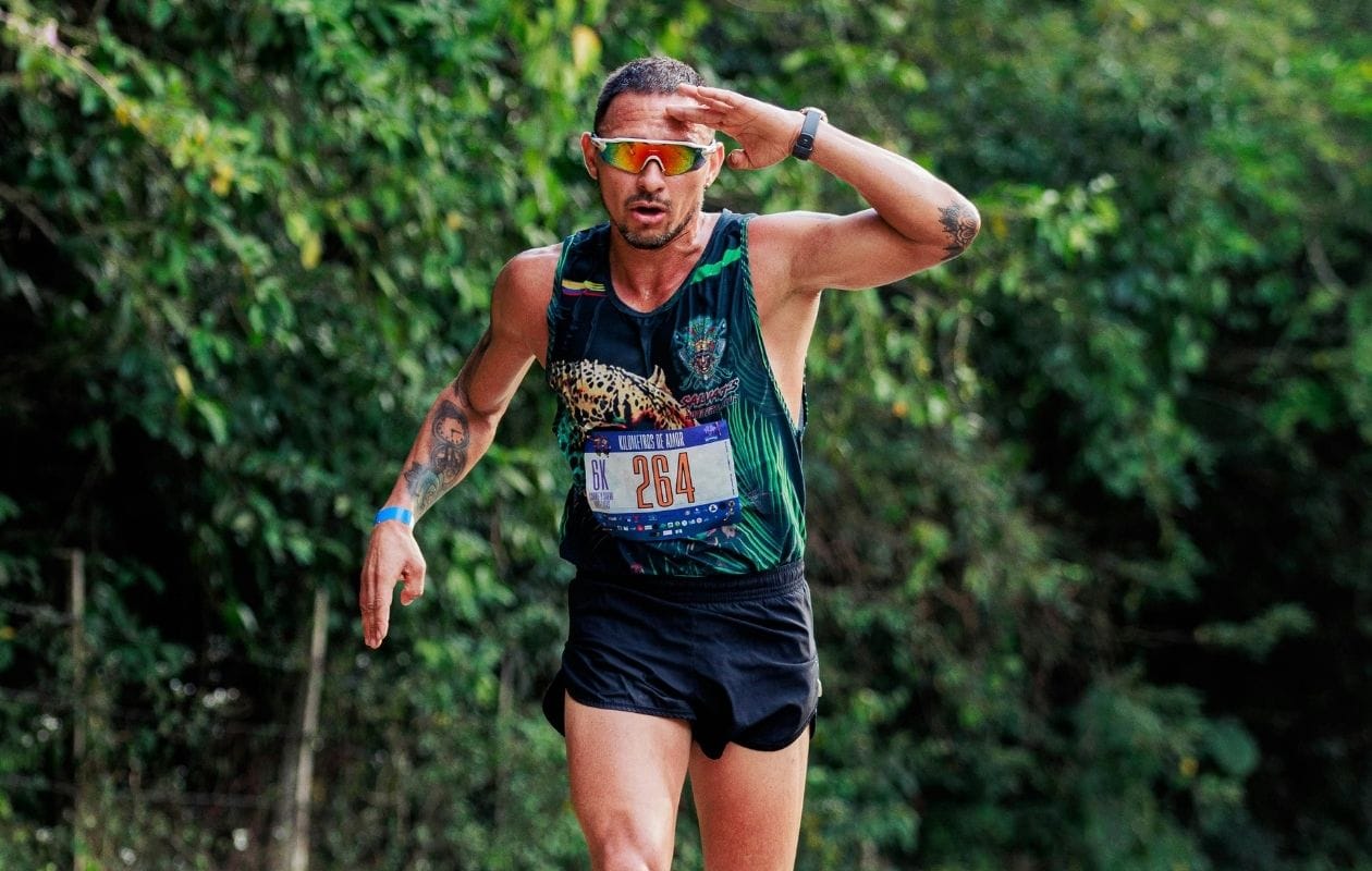 Male runner competing in a 6K trail race, returning to performance after running injury rehabilitation